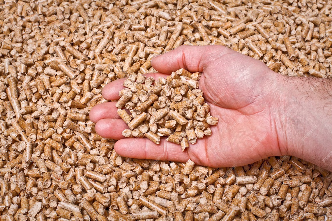A close-up of feed in a trough, with clear visuals of the varied grains and supplements